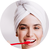 Woman with towel on head smiling