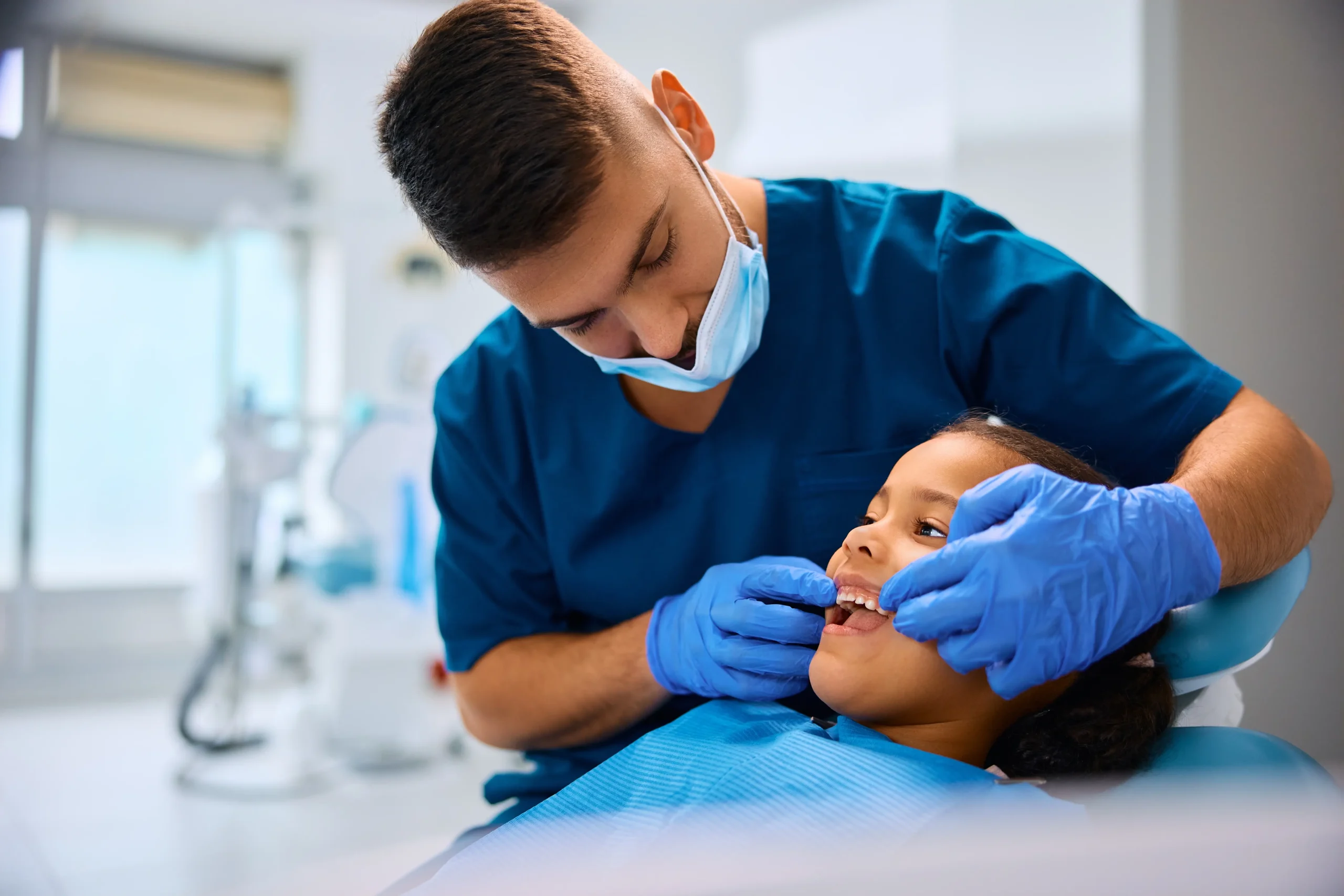 Pediatric dentist with child